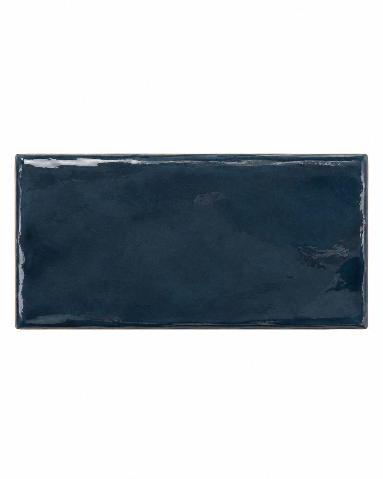 Mindelo Glans Midnight 6,5x13 glanzende donkerblauwe wandtegel op een witte achtergrond
